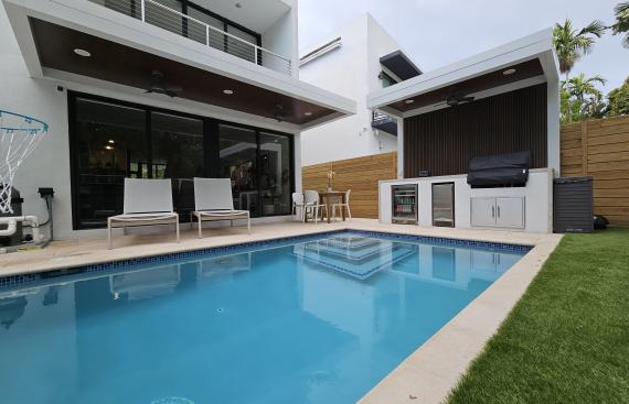 Terrace, pergola and outdoor kitchen set with predominant white color