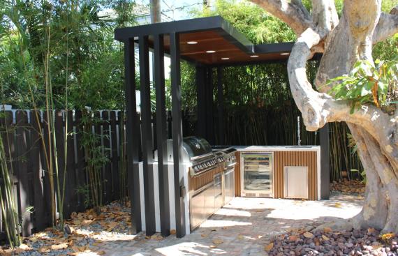 Stainless steel outdoor kitchen with narrow pergola