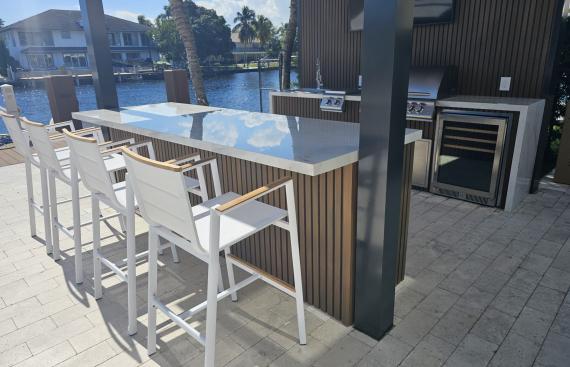 Small imitation wood pergola with outdoor kitchen