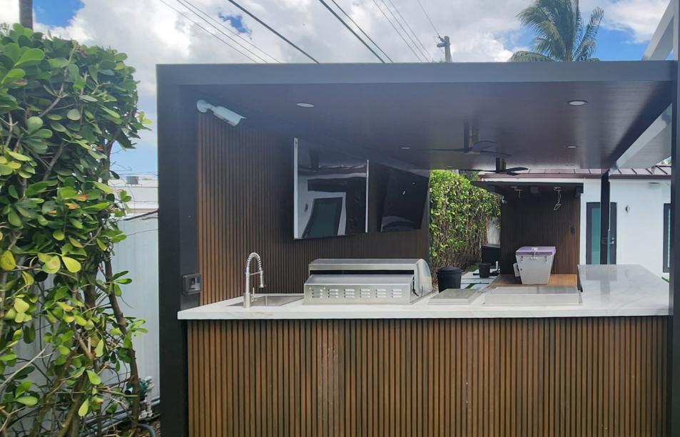 Outdoor kitchen and pergola with imitation wood walls