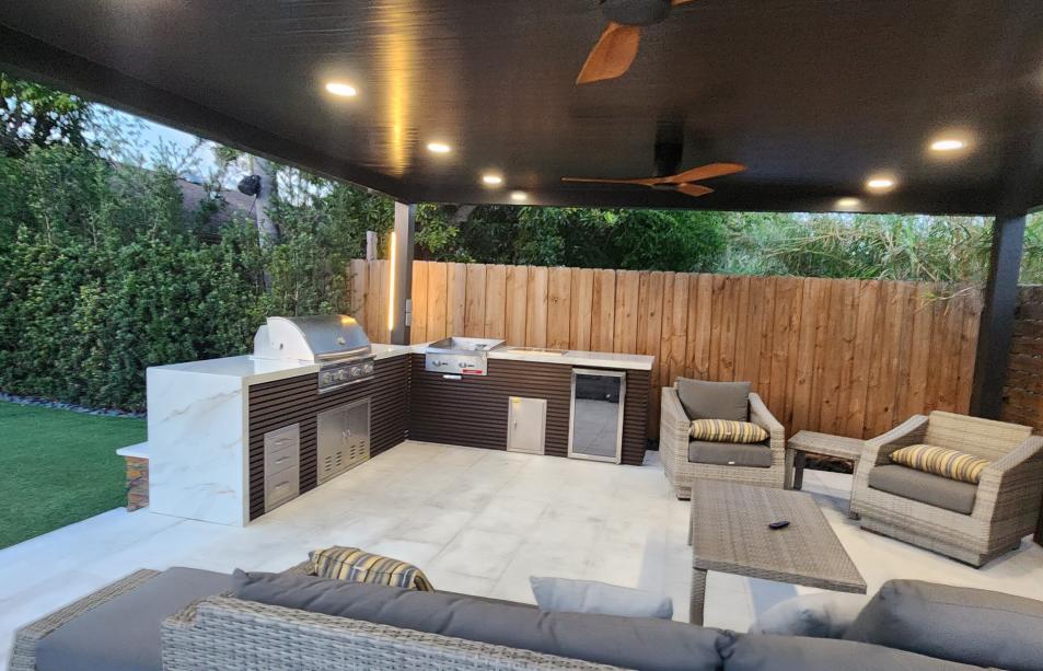 Modern aluminum pergola with outdoor kitchen and LED lighting system