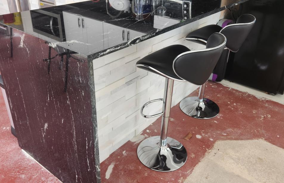 Modern outdoor kitchen with stone simulation