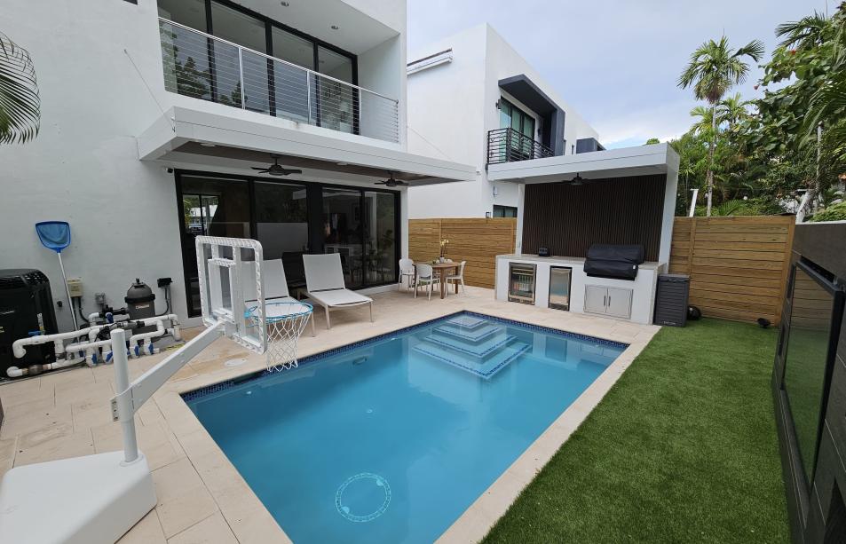 Terrace, pergola and outdoor kitchen set with predominant white color