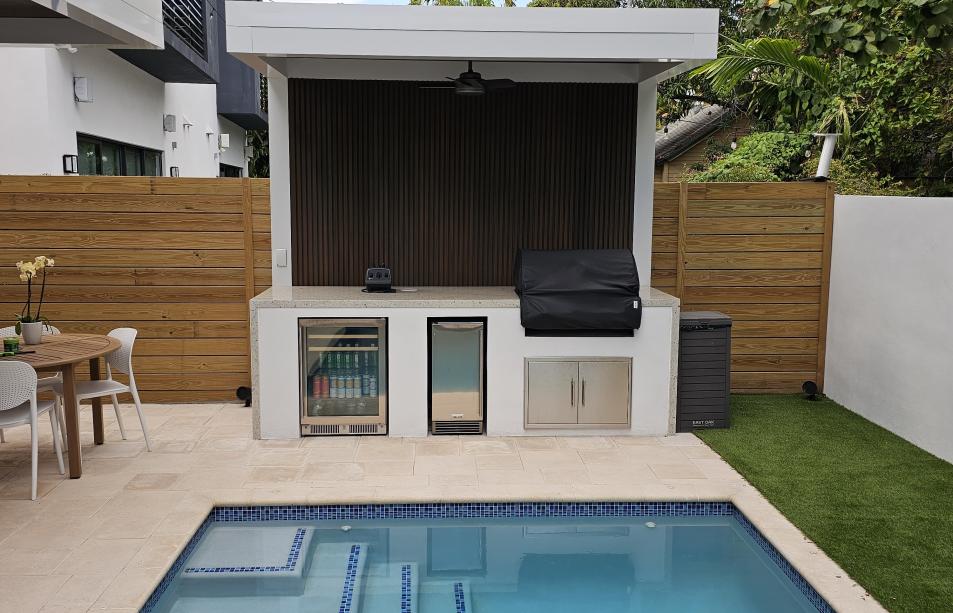 Terrace, pergola and outdoor kitchen set with predominant white color