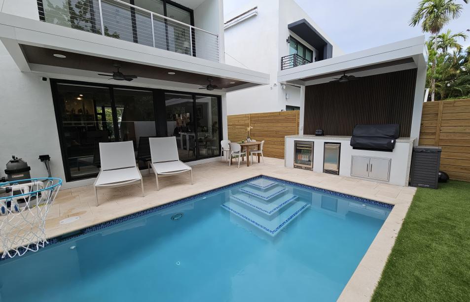 Terrace, pergola and outdoor kitchen set with predominant white color