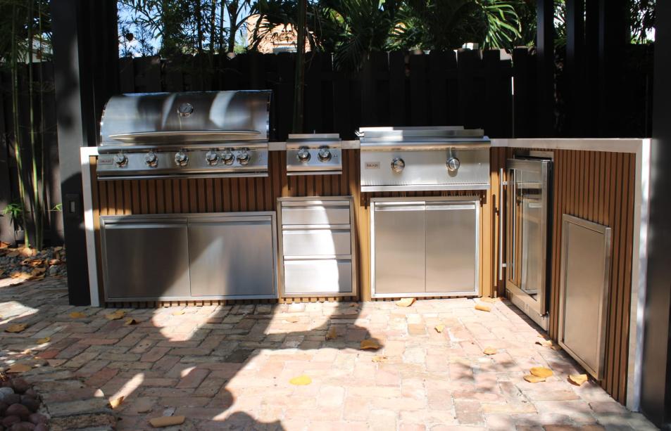 Stainless steel outdoor kitchen with narrow pergola