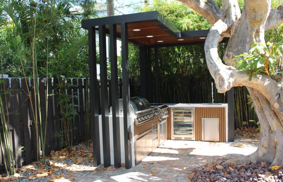 Stainless steel outdoor kitchen with narrow pergola