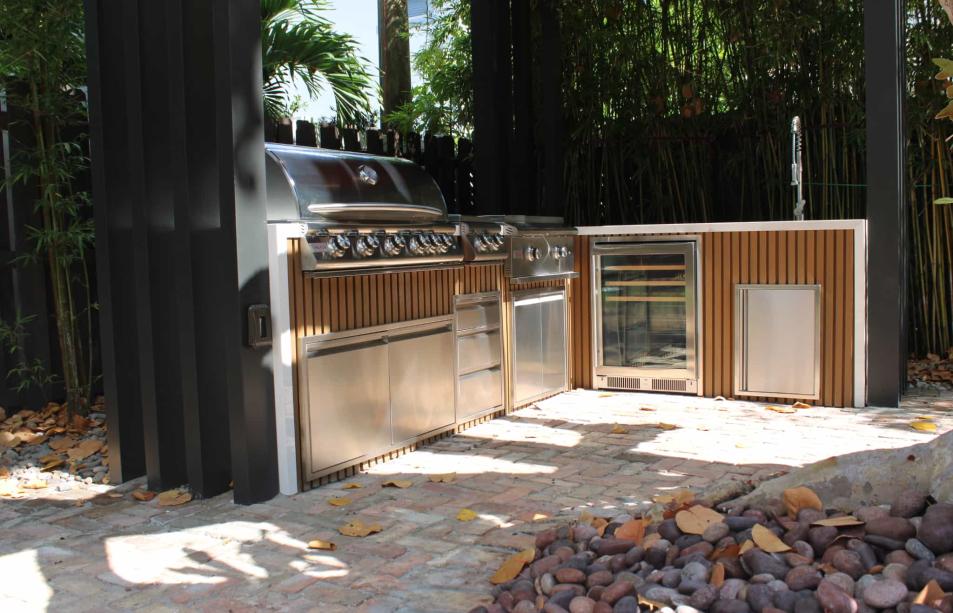 Stainless steel outdoor kitchen with narrow pergola
