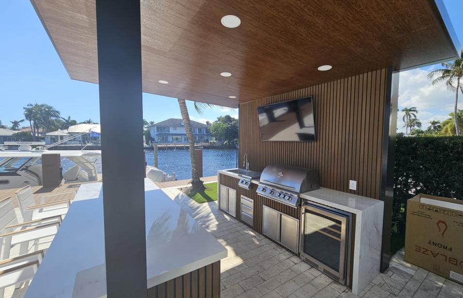 Small imitation wood pergola with outdoor kitchen